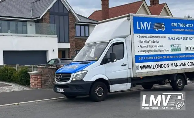 Professional moving team packing and loading the removals van