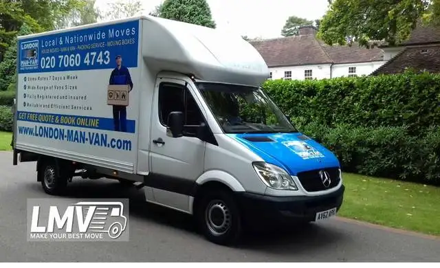 Cheap Man Van Queens Park team loading boxes into van with driver near me