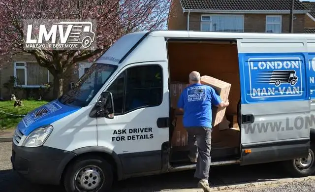 Professional London Man Van Team packing boxes and loading the van during a house move