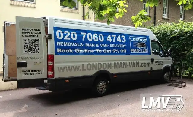 Movers loading boxes into a van in Cobham with the London Man Van team
